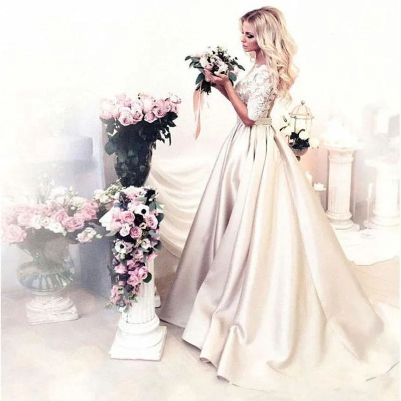 2018 Billiga Champagne Bröllopsklänningar Sheer Neck Half Sleeves Appliques Lace Satin En linje Bröllopsklänning Se igenom Back Buttom Bridal Dress