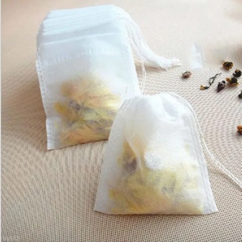 Promotion Nya Teabags 100 st Lot 5.5 x 7cm Tomma Teabags med String Heal Seal Filter Papper för ört Lös tepåse