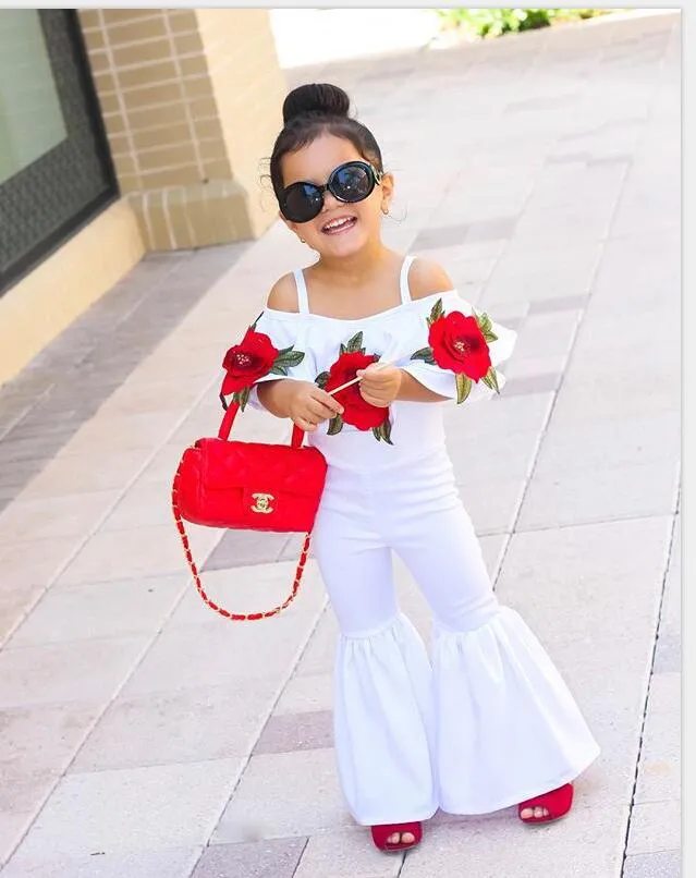 Moda 2018 Abbigliamento bambina bambina Fiore bambina con cinturino con spalle scoperte Top Pantaloni lunghi a zampa d'elefante Due pezzi Abiti bambini Set di abbigliamento bambina