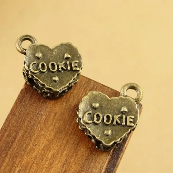 200 pcs heart shaped pendant charms antique bronze color with cookie good for DIY craft jewelry making