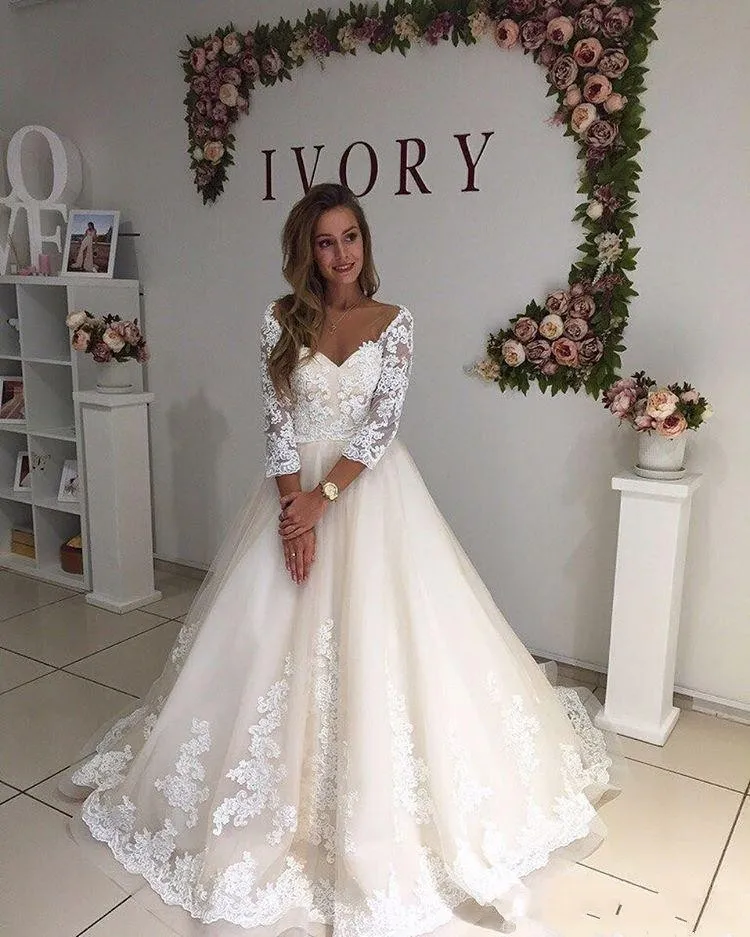Vintage Line A Wedding Dress with Long Sleeves, V-Neck, Lace Appliques, and Sweep Train - Affordable Plus Size Formal Bridal Gown