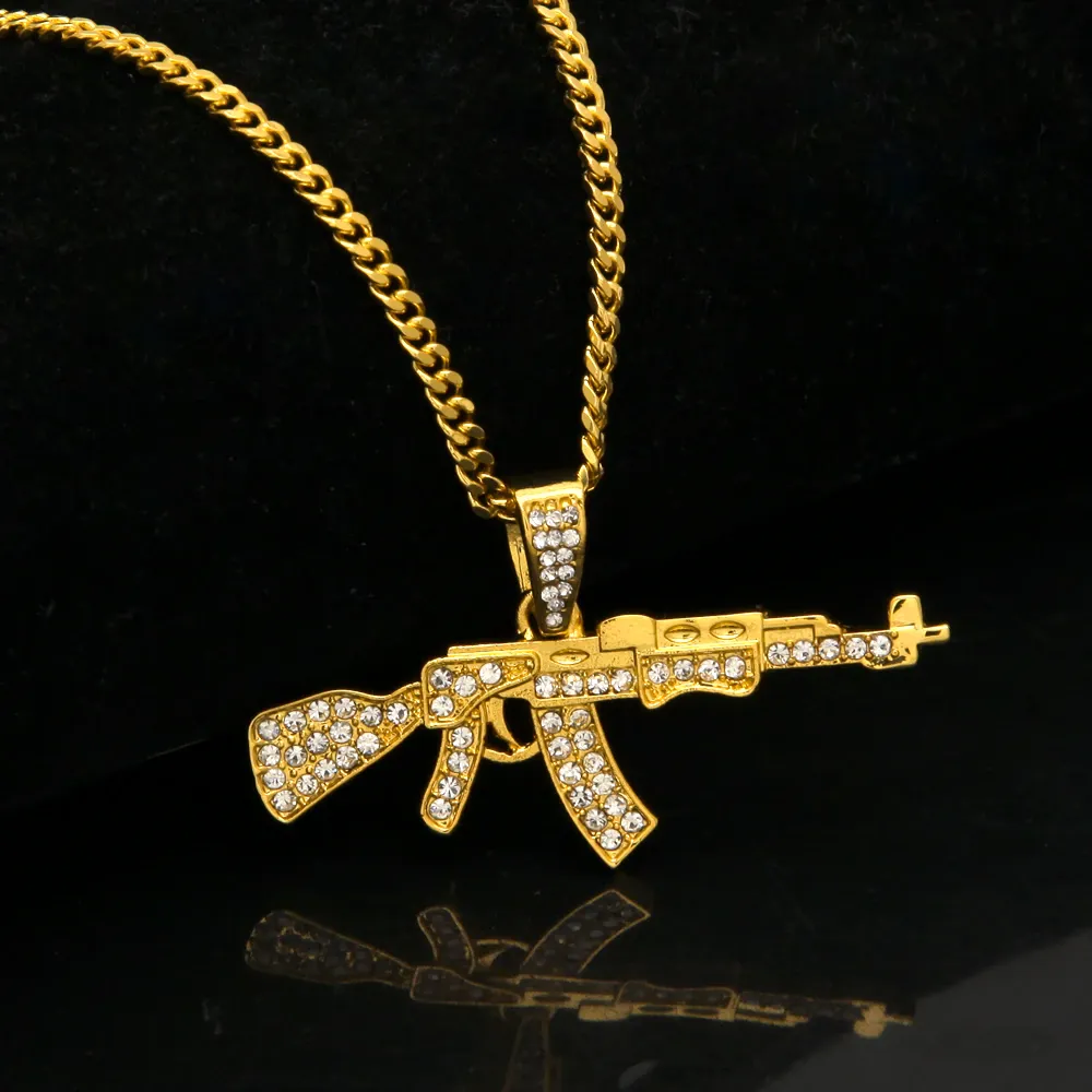 Gold chain hotsell with gun pendant