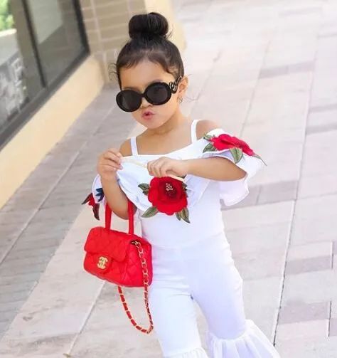 Moda 2018 Abbigliamento bambina bambina Fiore bambina con cinturino con spalle scoperte Top Pantaloni lunghi a zampa d'elefante Due pezzi Abiti bambini Set di abbigliamento bambina