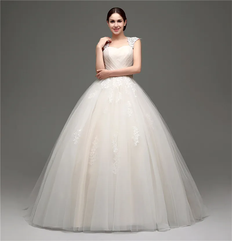 Splendidi abiti da sposa champagne abito da ballo pieghe accattivanti tulle con abiti da sposa in pizzo applique peplo