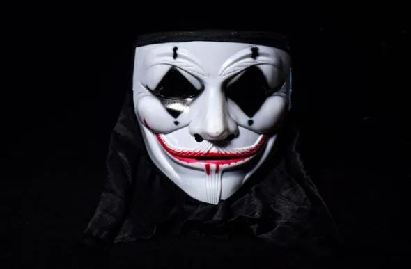 Man Wears A V For Vendetta Guy Fawkes Mask Stock Photo - Download