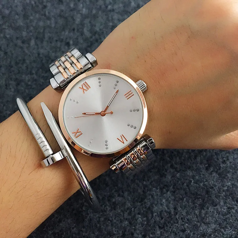 Montres de marque de mode femmes fille cristal Wstyle métal bracelet en acier Quartz avec Logo montre-bracelet AR 09