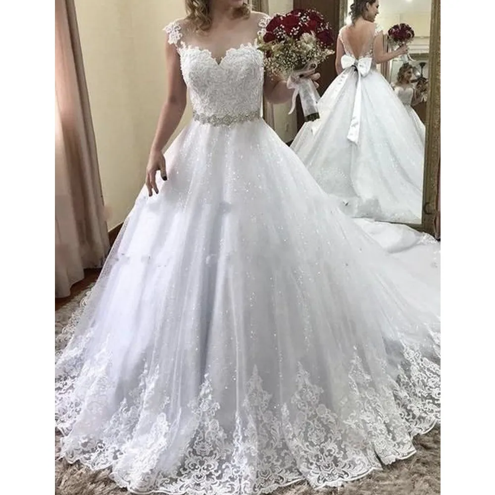 Abito da sposa scintillante con scollo a cuore e scollo a cuore in tulle trasparente, applicazioni di pizzo senza schienale, paillettes, abiti da sposa con cintura di pietre