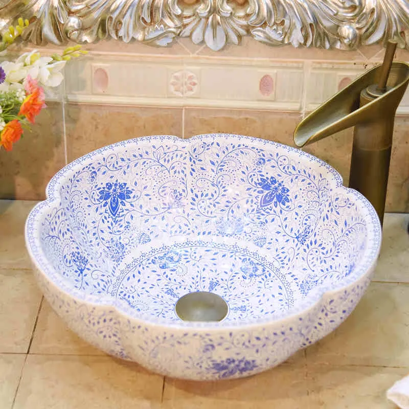 Lavabo da bagno rotondo in ceramica con motivo blu e bianco