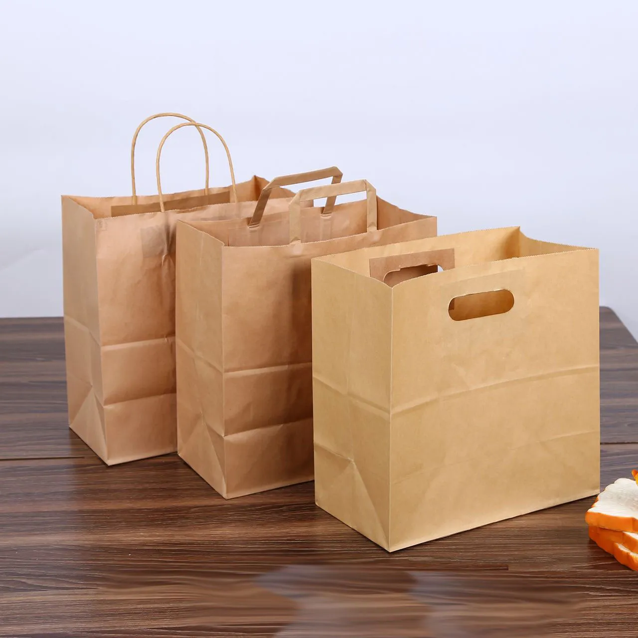 28x28+15 cm kraft paper bread bag packaging tote handle brown die cut baguette punching baking portable paper bag custom LOGO