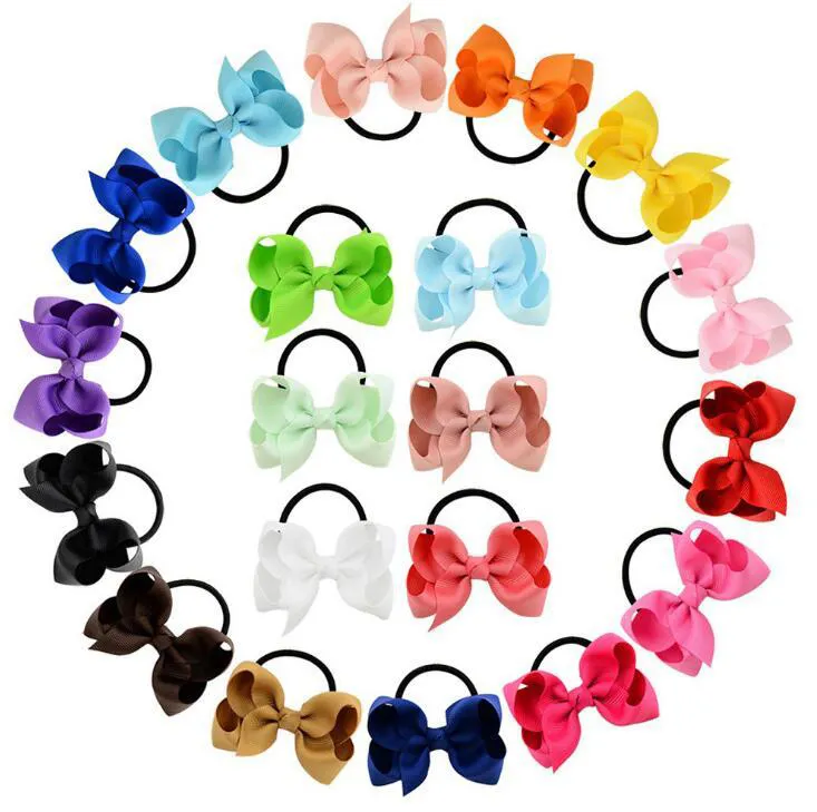 20 COLORES Cabello para niños color puro bebé mariposa pelo banda de goma banda de cuero banda de goma adorno para la cabeza.