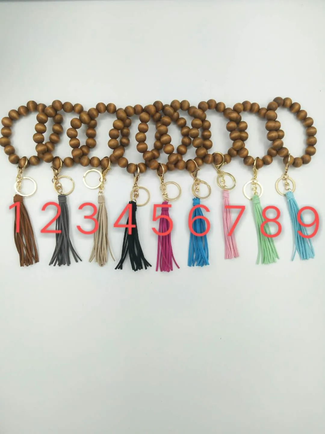 Cross-border hand-beaded wooden bead elastic rope bracelet keychain accessories tassel pendant