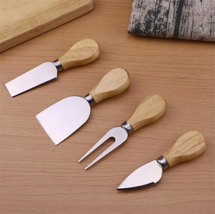 Användbara ostverktyg Set 4PC / set Eakhandtag Knivgaffel Skovelkit Gratrar för skärning Bakning Ostbräda Satser Smör Pizza Slicer Cutter