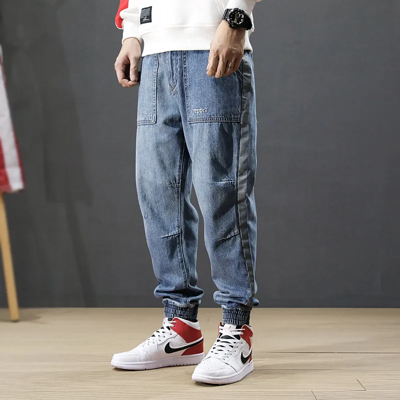 Japanse stijl mode mannen jeans losse spliced ​​designer grote pocket cargo broek harem jeans streetwear hiphop joggers mannen