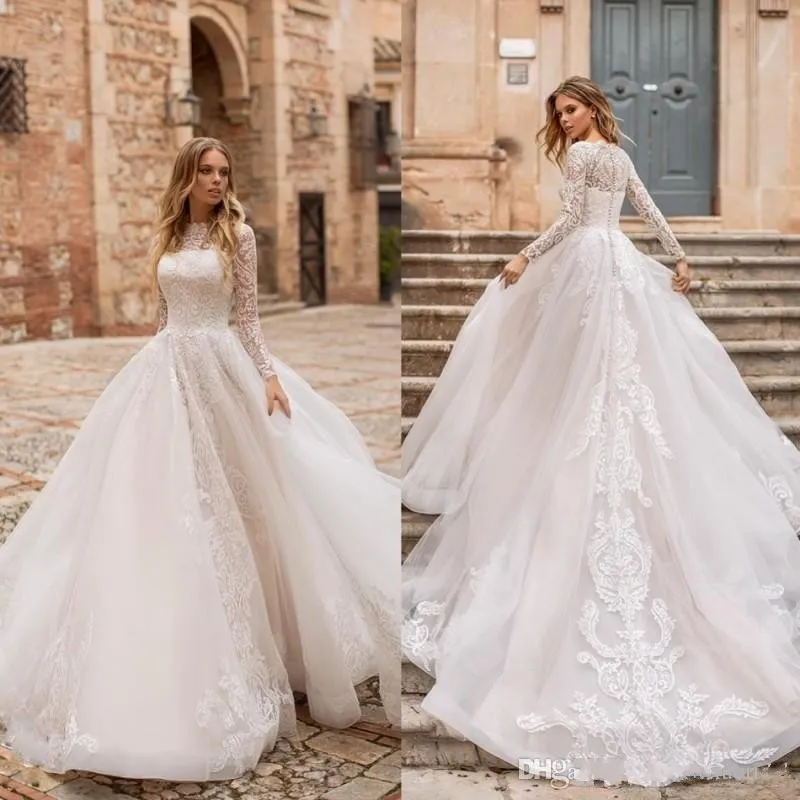 2020 New Hot Modern A Line Wedding Dresses Illusion Lace Appliques Long Sleeves Sweep Train Button Back Puffy Plus Size Formal Bridal Gowns