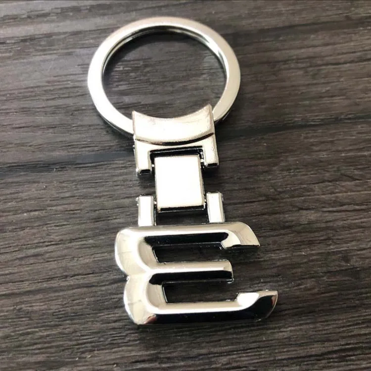 BMW 1 3 5 6 7 8 XSERIES X5 M5 F13 F15 E36 E39 E53 E60 Numero in metallo argento Lettere chiave Torta del portachiavi di portata Fashion Keyring9286894