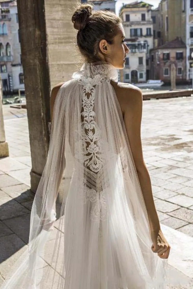 long sleeve halter top wedding dress This lace halter top wedding dress with that AMAZING train could be the one   You wont know until you try it on!!, Come experience the magic at  Facchianos  Hurry and call us or book your