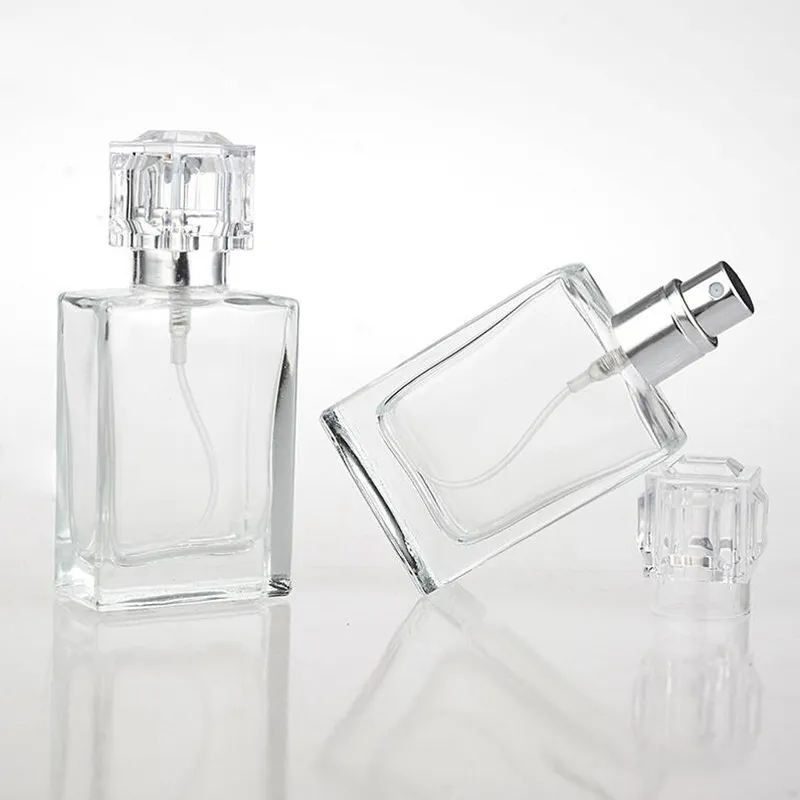 100PCs tomma klara kristallglas parfymflaskor 30ml pumpsprayer påfyllningsbara glasflaskor för resorstorlek