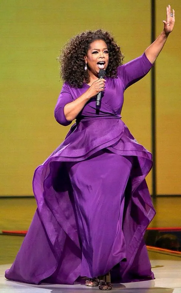 Oprah Winfrey looks chic in a purple gown at the Golden Globes