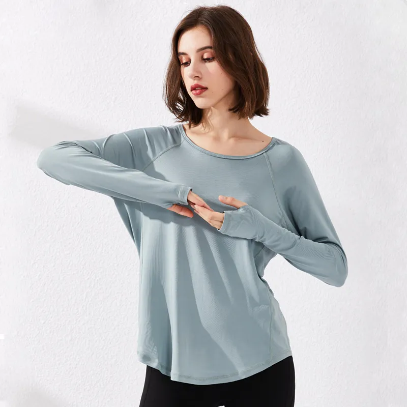 Den nya sträckan Snabbtorkande löst skjorta Kvinna Fitness Andas Mesh Running Training Yoga Långärmad T-shirt Kvinna