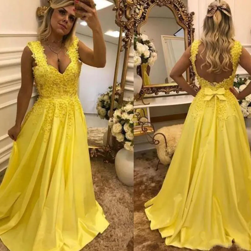 Robes de bal jaunes attrayantes longue robe formelle perlée dentelle appliques sans manches dos nu longueur de plancher une ligne robes de soirée