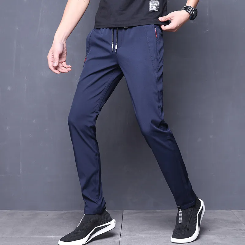 Pantaloni estivi Uomo Skinny Stretch Coreano Pantaloni casual Slim Fit Chino Elastico in vita Jogger Pantaloni eleganti Uomo Nero Blu SH190915