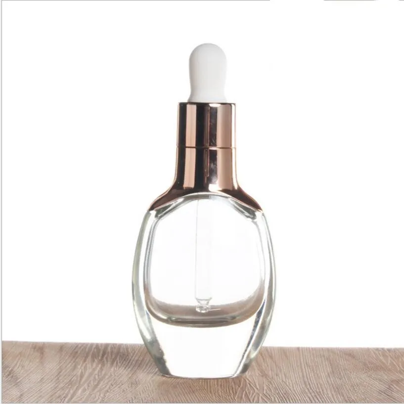 Bouteille d'huile essentielle en verre transparent de 30 ml, avec couvercle compte-gouttes en or rose, flacon d'huile, récipient cosmétique, vente en gros