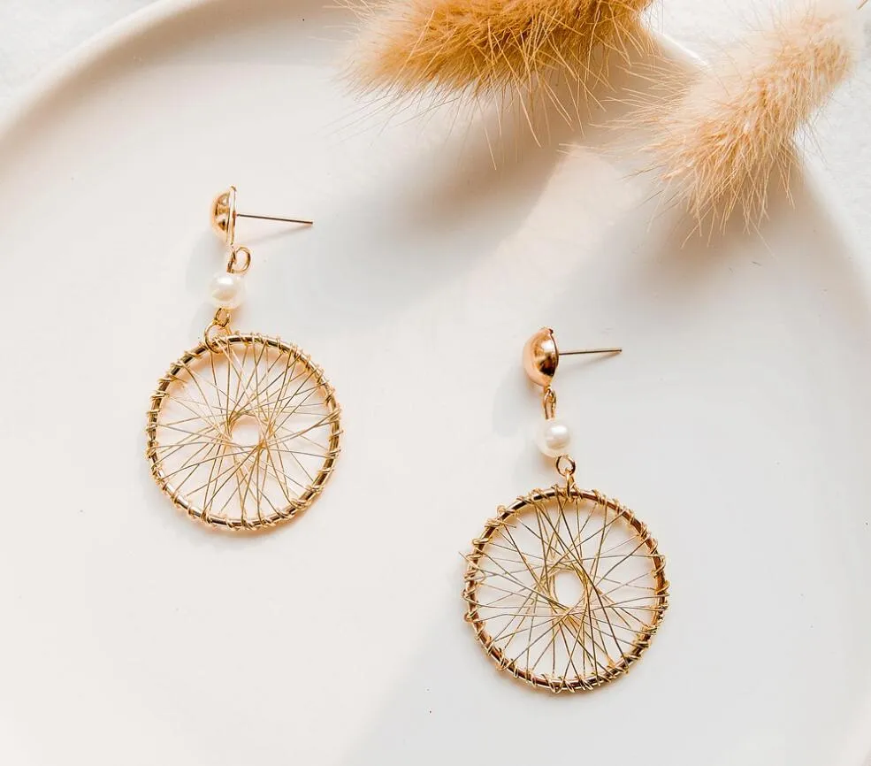 Wholesale- new ladies personality ethnic wind dream catcher ear temperament street patting simple style simple jewelry