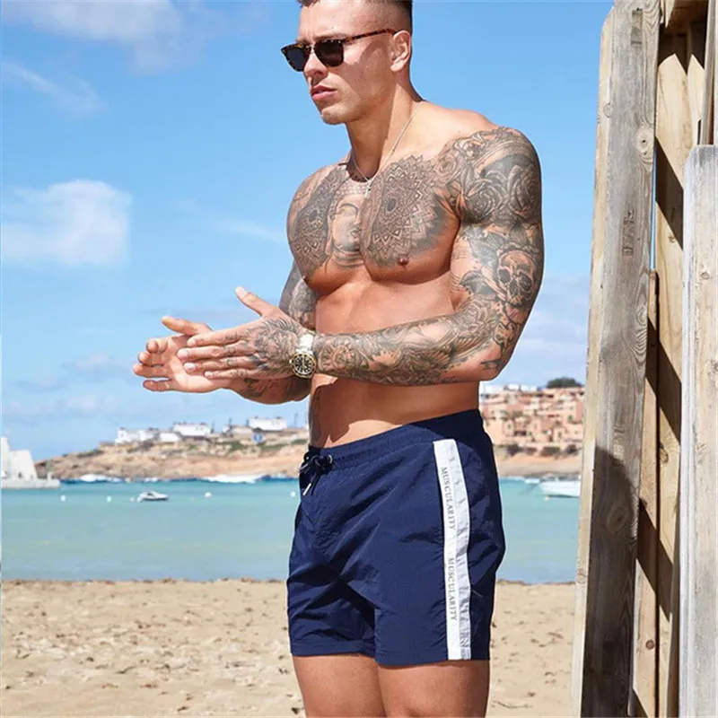 YEMEKE-2019-Beach-Shorts-Mens-casual-shorts-compress-Quick-drying-fashion-men-shorts-bermuda-Fitness-shorts.jpg_640x640 (2)