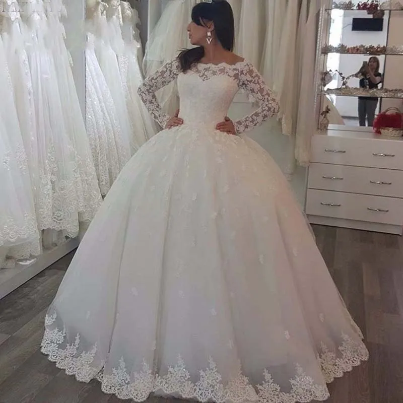 2019 Abiti da sposa principessa Ball Gown Sheer Bateau Neck Illusion maniche lunghe Appliques in pizzo Abiti da sposa gonfi Lunghezza fino al pavimento