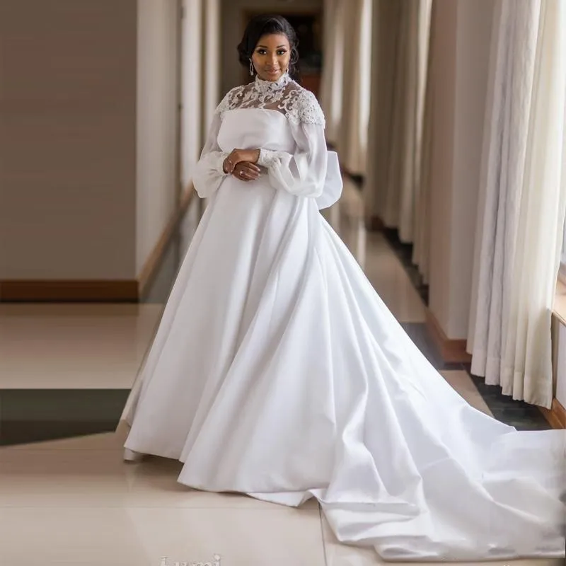 Africain Plus La Taille Robes De Mariée Satin Col Haut Flare À Manches Longues Grand Noeud Papillon 3D Appliques Robe De Mariée Avec Ceinture Perlée Robes De Mariée