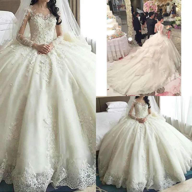 Vestidos de novia de encaje con vestido de bola hinchado de marfil de lujo con corsé con cuentas de organza de tren catedral Vestidos de novia de princesa de manga larga de ilusión