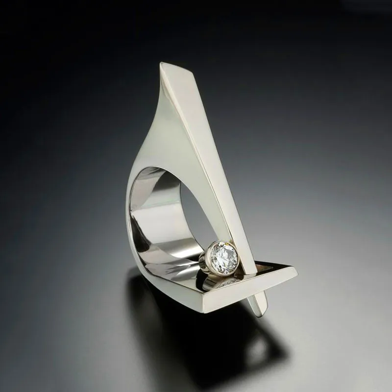 ユニークな女性の小さな丸ジルコンのリングのファッション幾何学者の指輪女性のためのヴィンテージの銀の結婚指輪