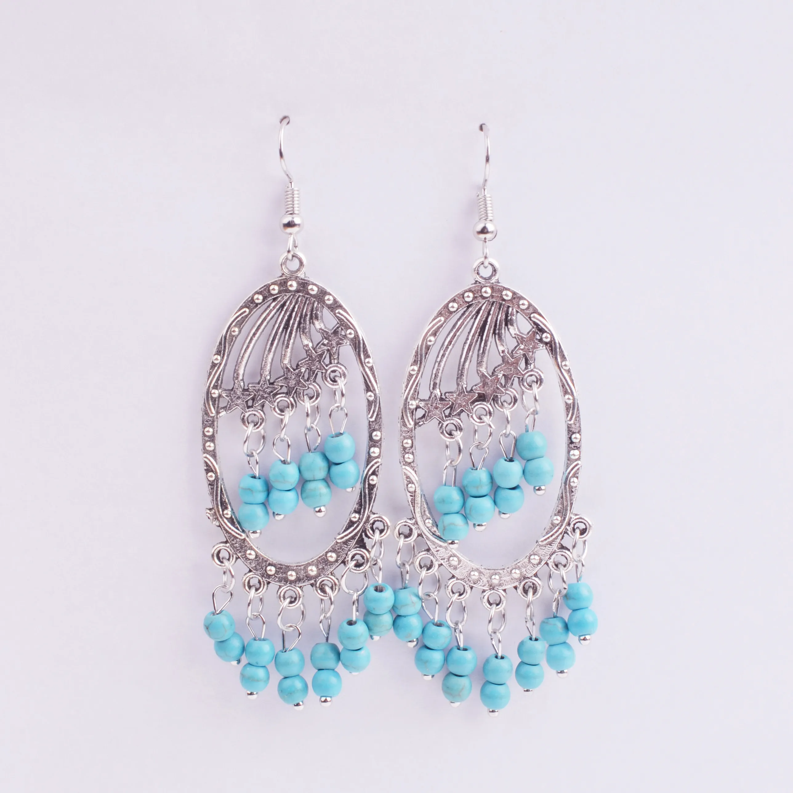 Mode européenne et américaine rétro gouttes d'eau bleu turquoise gland boucles d'oreilles longue section perles de riz creuses bohème vent national boucle d'oreille