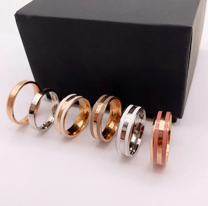 Rose Gold Titanium Steel Love Ring Bröllopsdesignerälskare Ring för Kvinnor Förlovningsringar Män Smycken Gåvor Mode Tillbehör