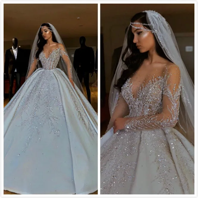 Luxurious Sparkly 2019 African Wedding Dresses Sheer Neck Long Sleeves Bridal Dresses Beaded Sequins Satin Wedding Gowns