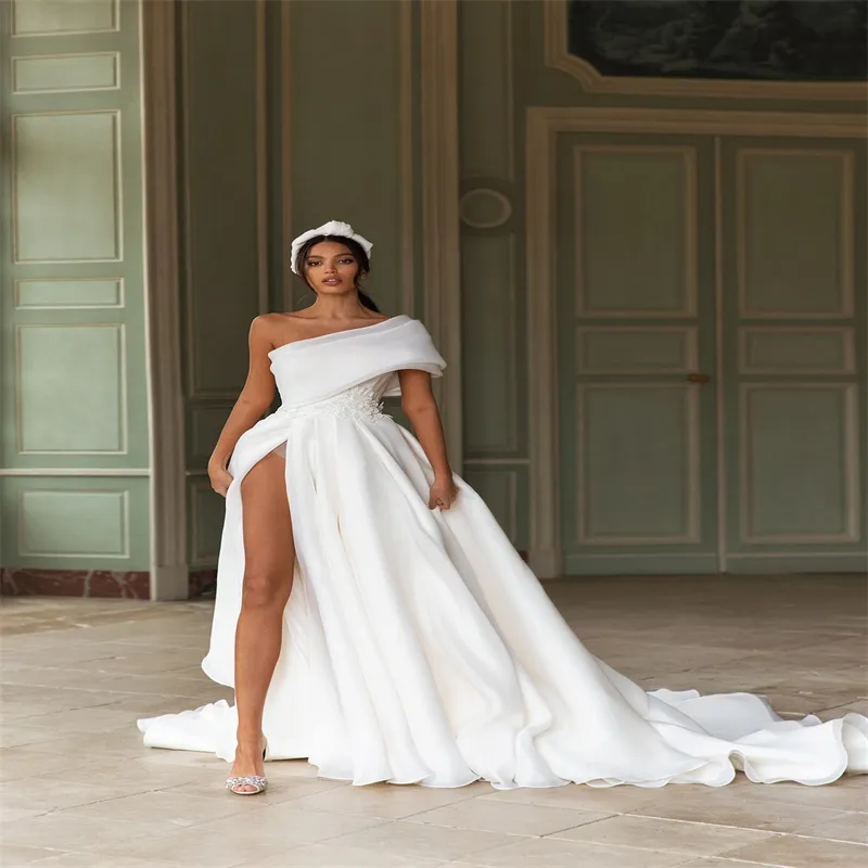 Gorgeous One-Shoulder one shoulder wedding dress with High-Splash Applique, Beaded Sash, Bow, and Sweep Train in Satin Backless Fabric - Robes de