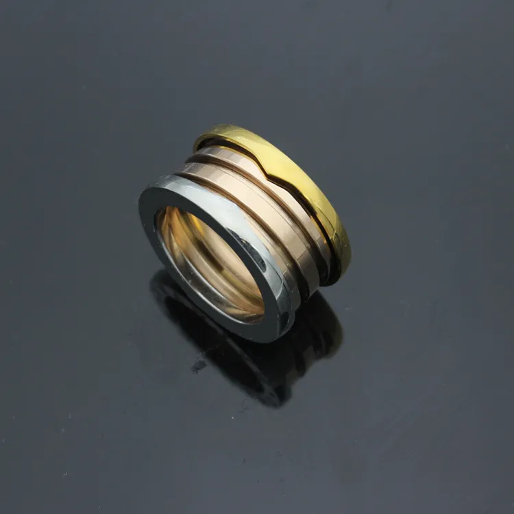 Anillo de engranaje de oro rosa chapado en acero de titanio al por mayor-316L para parejas joyería de anillo de resorte