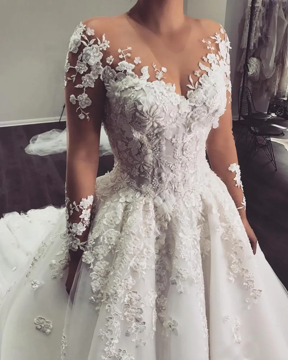 Arabic A Line Wedding Dresses Sheer Jewel Neck Long Sleeves Lace Appliques 3D Flowers Beaded Plus Size Court Train Tulle Bridal We1924