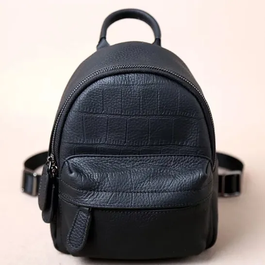 Barato mochila mulheres moda saco de viagem de couro macio super grande volume bolsas com um punho absolutamente alto custo eficaz