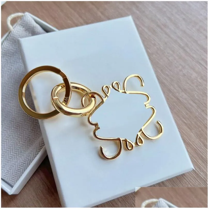 Fashion Luxury Key Designer Carabiner Car Keychains Mens Anagram Pendants Chain Lover Couple Bags Metal Keyrings Sier Gold Drop Deliv Dhinu