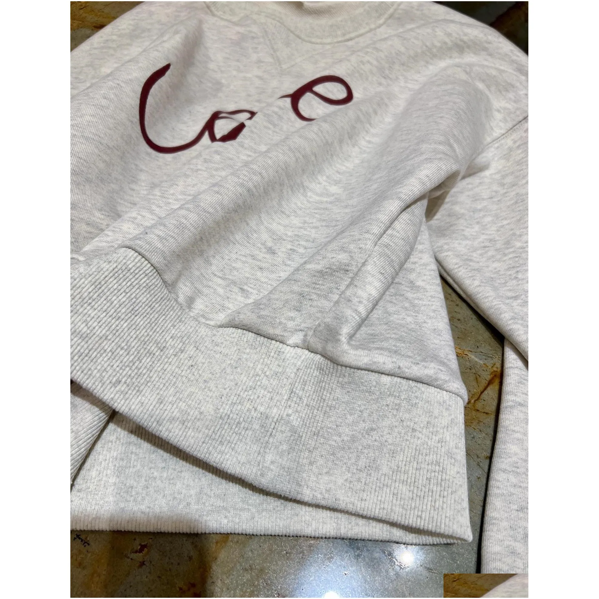 2024 early spring new sports and leisure style gray white letter pattern round neck long sleeved loose hoodie woman sweater