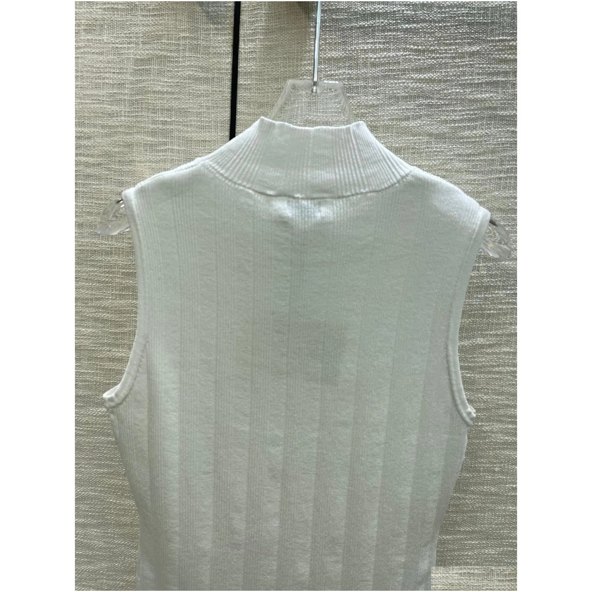 latest collection in early spring 2024, embroidered logo knit vest