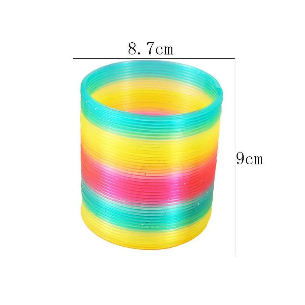 Novelty Games Childrens Spring Magic Ring 9Cm Large Mesh Bag Gamesrainbow Kids Birthday Party Favors Boys Surprise Giveaway Carnival Dhfse