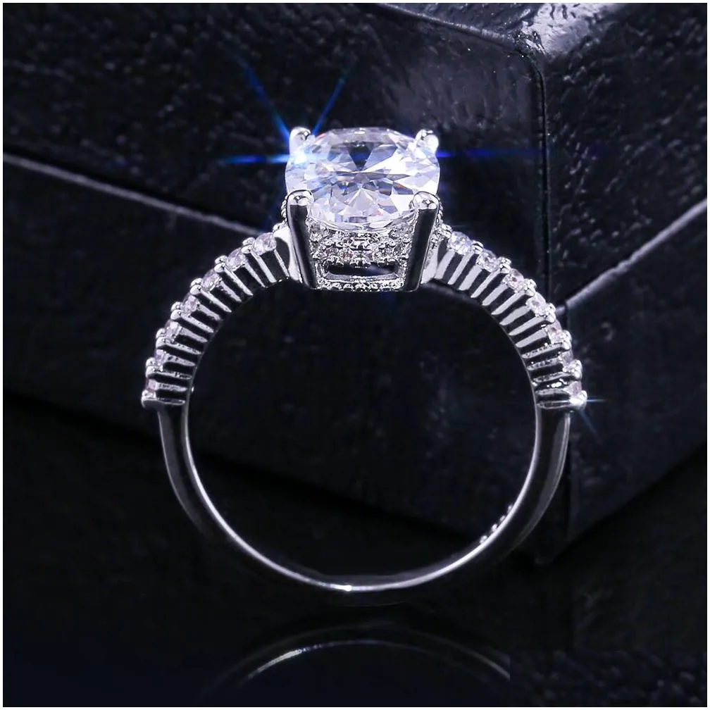 With Side Stones European American Fashion Sparkling Oval Diamond Engagement Ring Elegant Cubic Zirconia Paved Copper Brass 925 Sier Dhrev