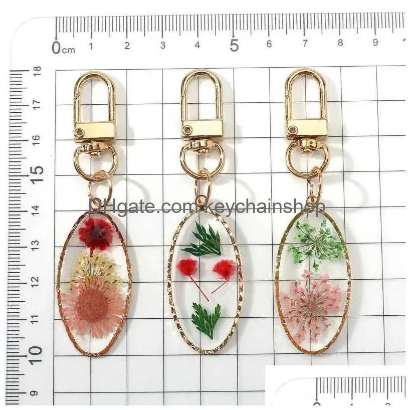 Keychains & Lanyards Oval Pressed Real Dried Flower Daisy Pendant Key Chain Metal Plated Rotationable Ring Jewelry R231003 Drop Deliv Dhtri