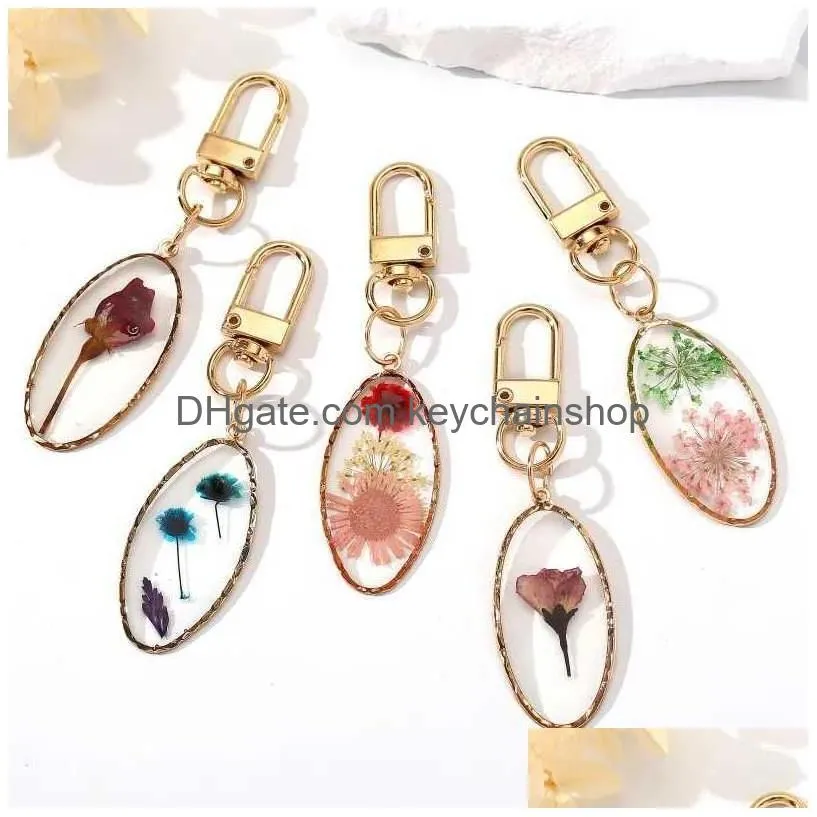 Keychains & Lanyards Oval Pressed Real Dried Flower Daisy Pendant Key Chain Metal Plated Rotationable Ring Jewelry R231003 Drop Deliv Dhtri