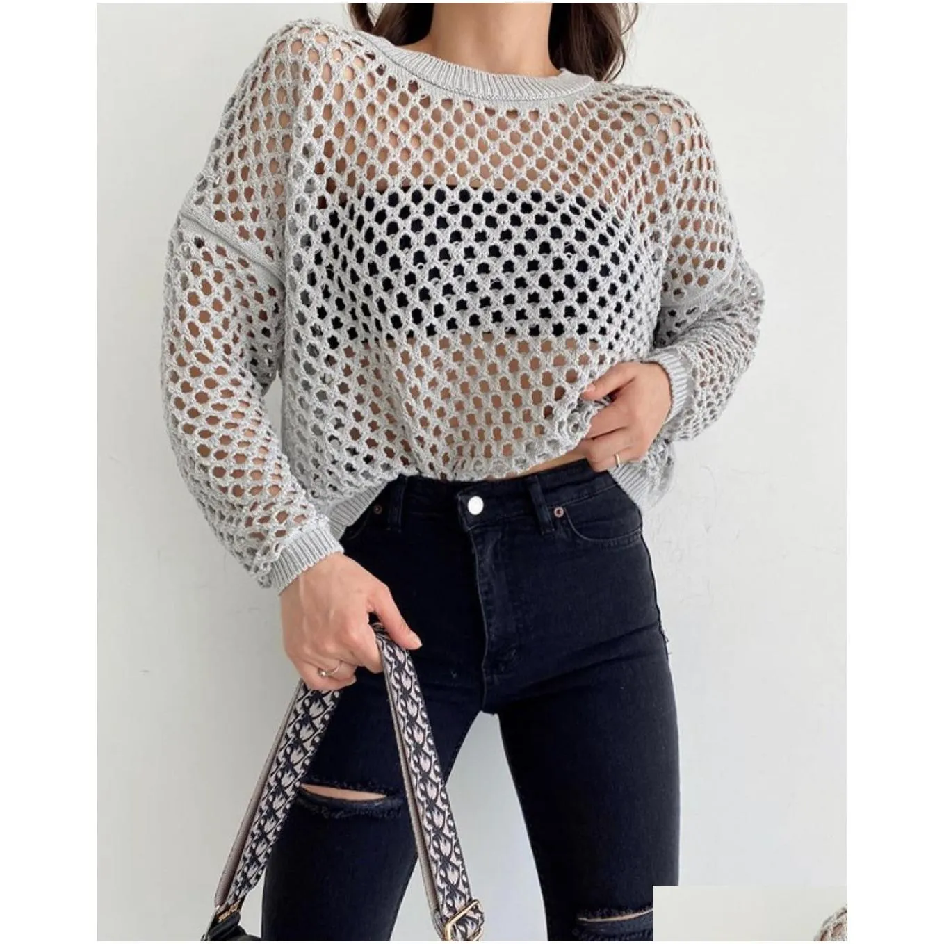 Women`s Sweaters European and American sweater flared sleeve loose foreign trade round neck hollowed out sweater woman