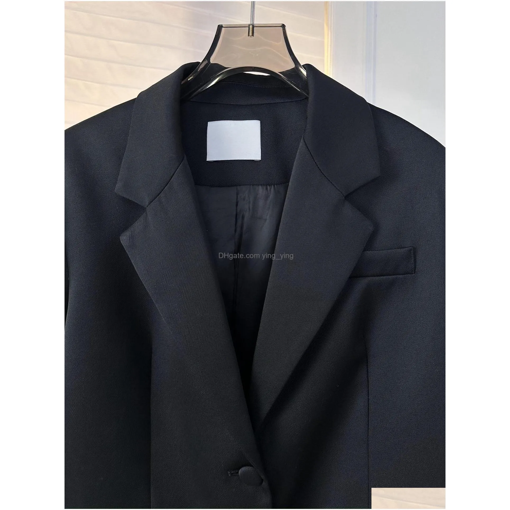 in early spring of 2024 a french casual suit jacket with detachable ostrich furwork cuffs