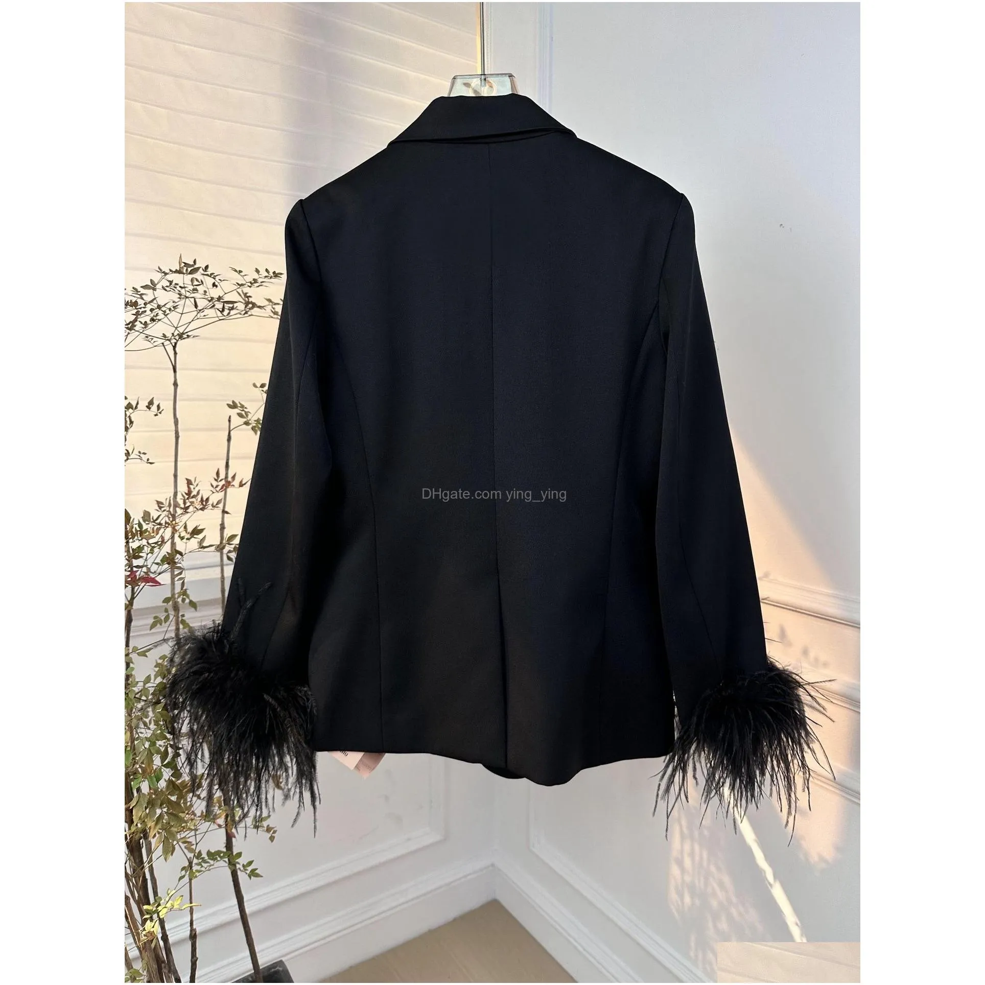 in early spring of 2024 a french casual suit jacket with detachable ostrich furwork cuffs