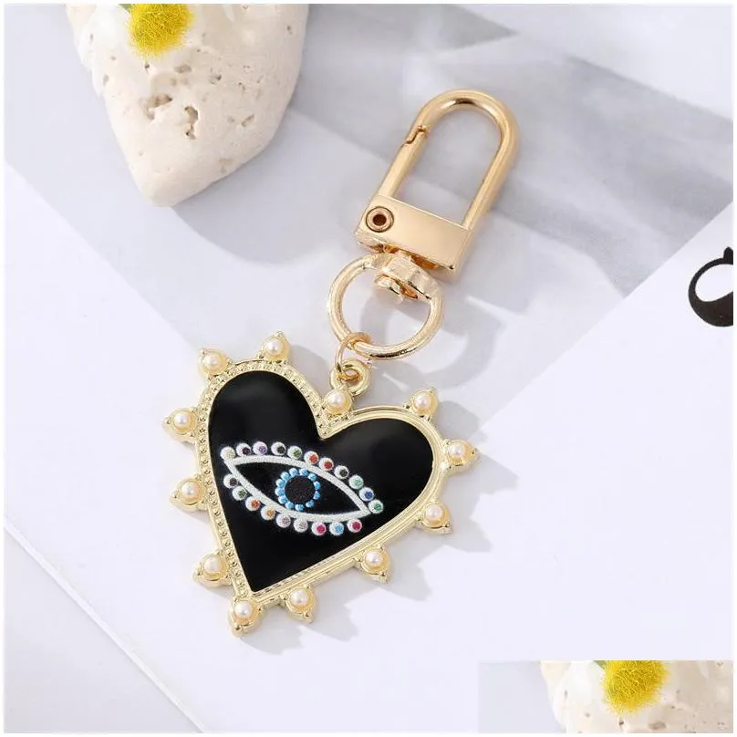 rhinestones pearl evil eyes keychains alloy men women peach love heart devils eyes bag car keychain pendant in bulk